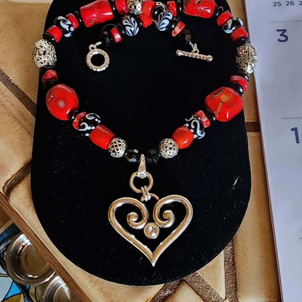 Hand designed coral necklace and earring set made by Rena.